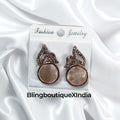 Crystal Flame Designer Stud Earrings – Champagne Shell | BlingBoutiqueXIndia